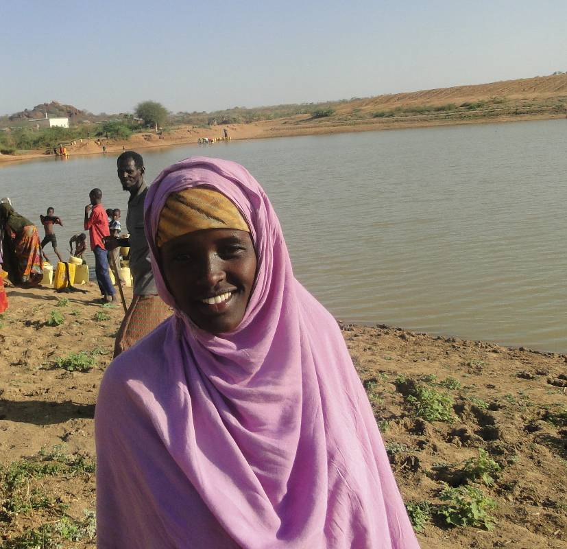 Amina at the Korondille village water pan, which has been improved through the Islamic Relief Kenya project.