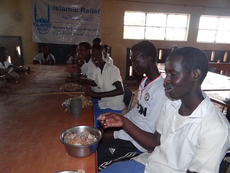 Abdi and his school-friends enjoy a meal made with Qurbani meat.
