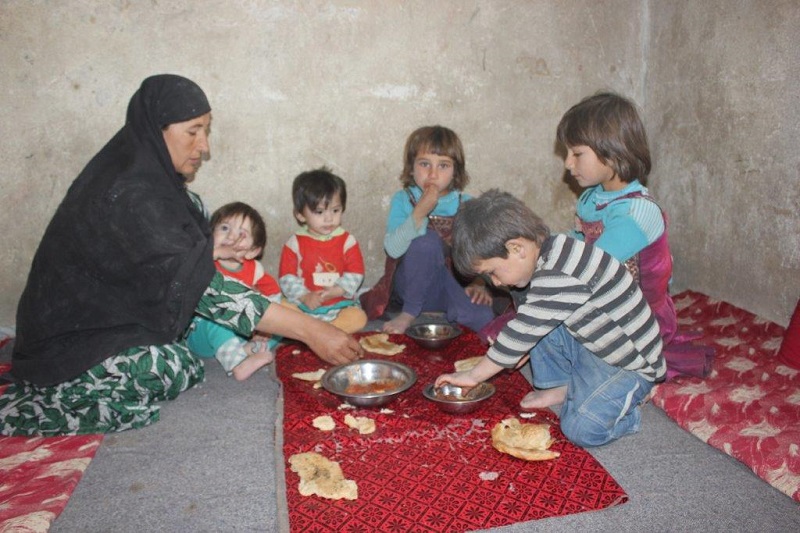 Amana and her children enjoy their Qurbani meat.
