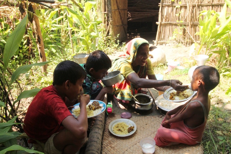 Jahanara and her family enjoy their Qurbani meal.