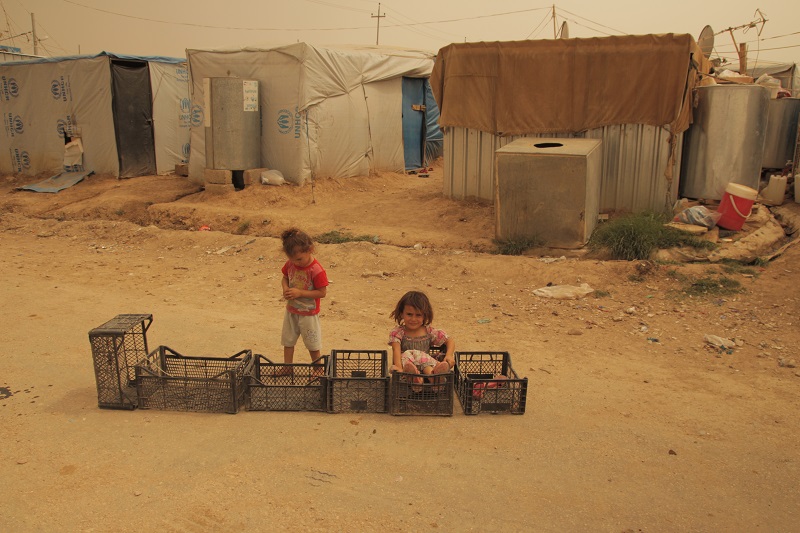 Yazidi children play outside their temporary shelters in Sinjar.