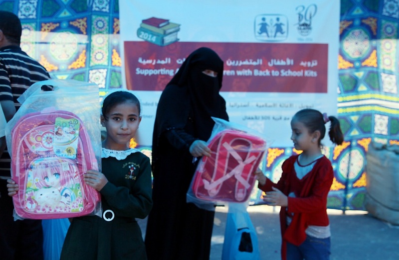 Children receiving their school bags