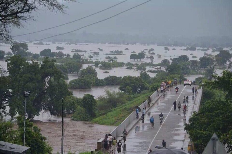 Some 70,000 people have fled their homes as floodwaters sweep Malawi.