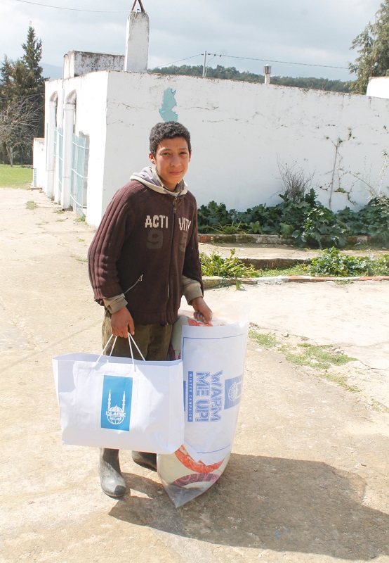 Fedi Mejri, 12, with his  winter kit provided by Islamic Relief.