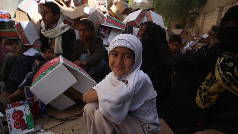 A young girl at an Islamic Relief food distribution in Sana'a, Yemen.
