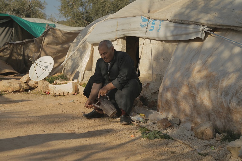 Unable to return to his village, Abu Basam lives in a tent.