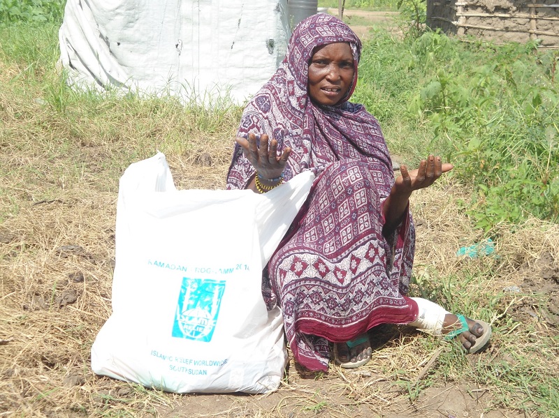 Habiba with her family foodpack.