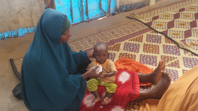 A mother and child accessing health services by Islamic Relief in Ifo camp.
