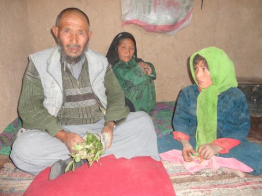 Mohammad at home with his wife and daughter.