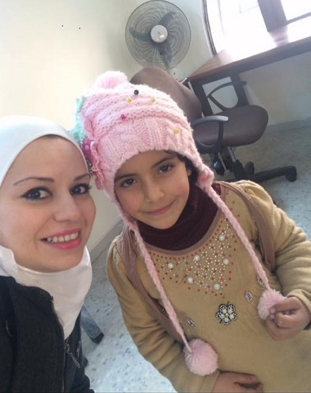 Hiba with an orphaned girl sponsored by Islamic Relief.