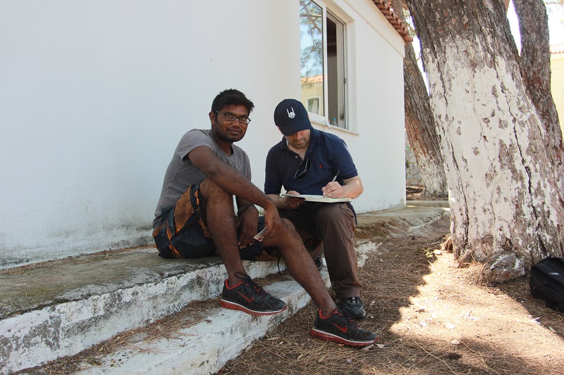 Islamic Relief staff speak to a refugee at Pikpa camp, a previously disused site now run by local volunteers.