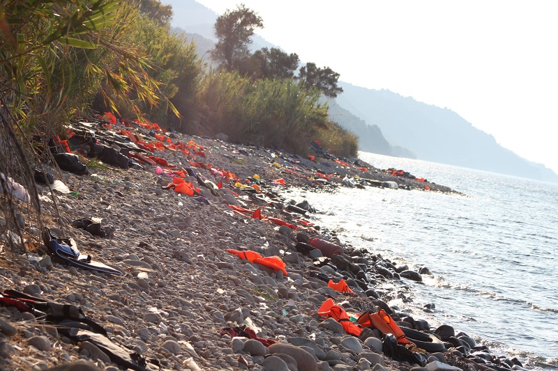 A Lesvos beach littered with debris from sea journeys by desperate refugees.