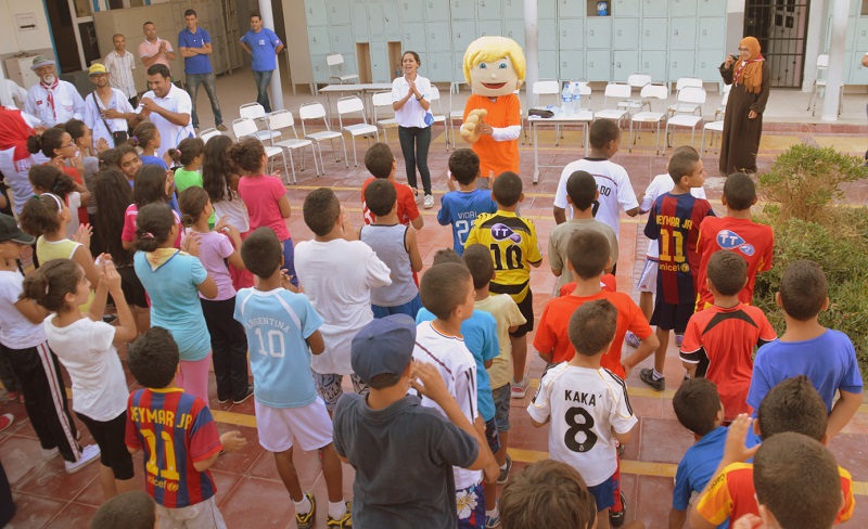 Children dance with mascot Mr Clean.