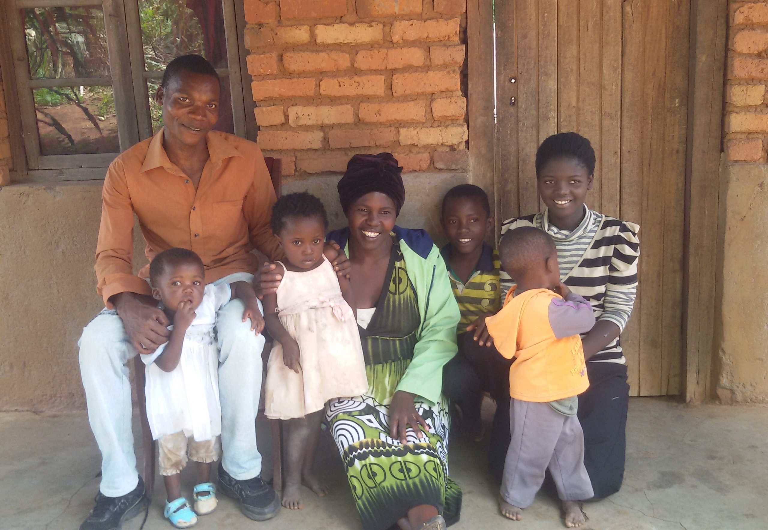 Lydia (centre) and her family in Malawi