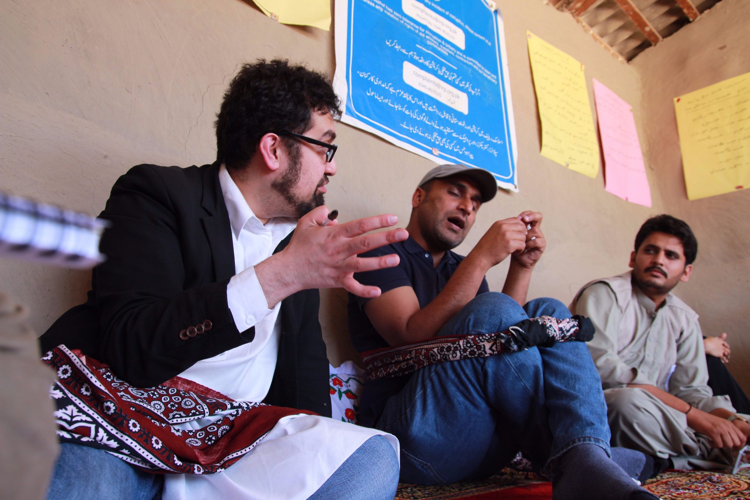 Hamayoon is pictured, left, evaluating the programme in Pakistan